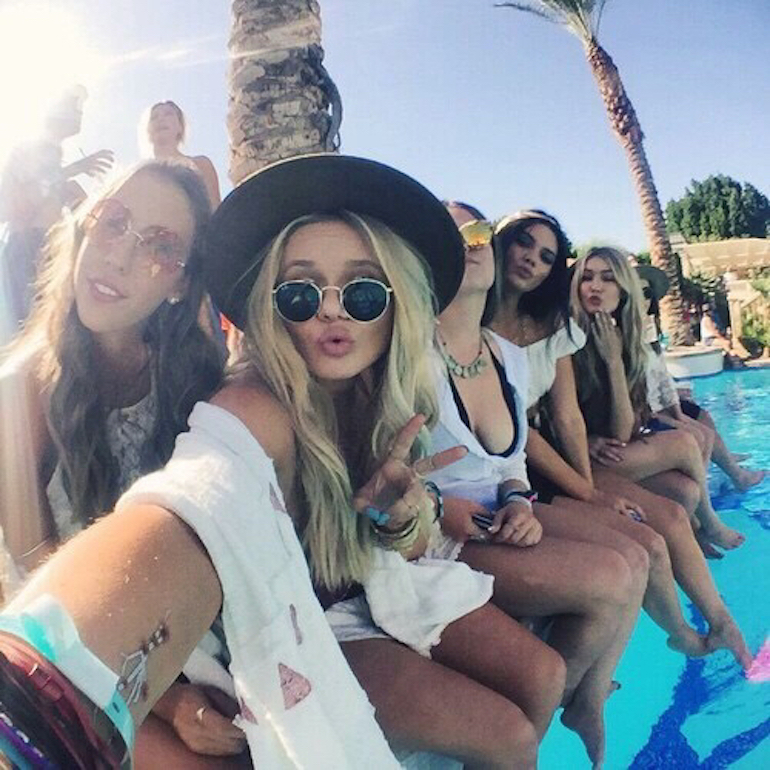 Girls selfie at a beach pool party