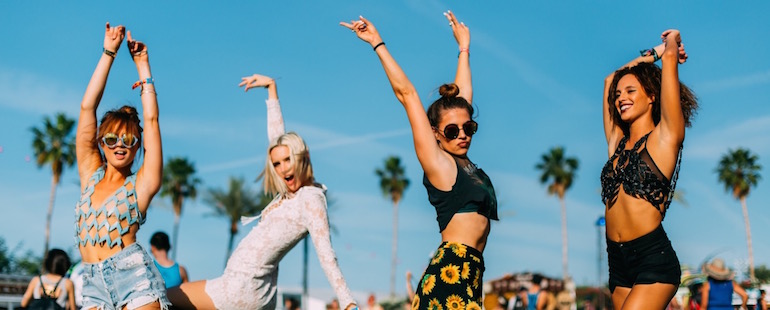 Girls dancing at a beach party