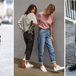 Step away, skinnines! Mom jeans rule. Models wearing mom jeans, stilettos and sneakers walk down street.