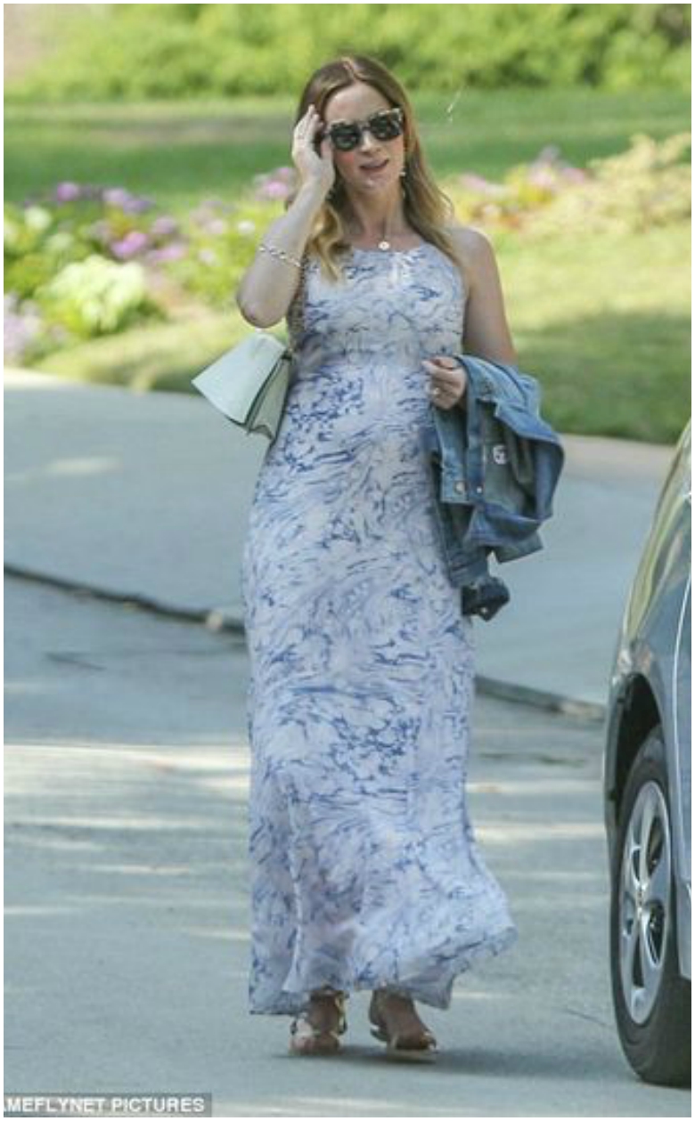 Pregnant Emily Blunt in blue and white patterned maternity maxi dress with denim jacket and cream handbag