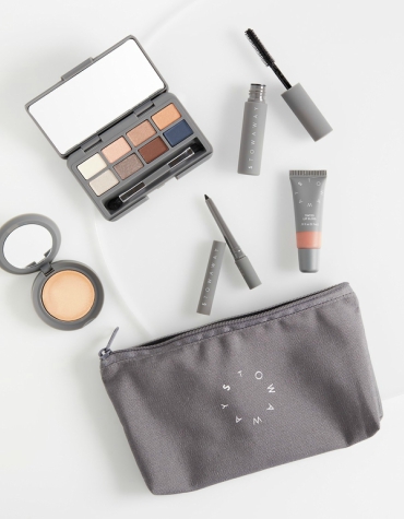 essentials for eyes, lips and face with cosmetics bag