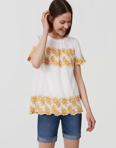 Gilded floral embroidered top in cotton with short sleeves and back button keyhole