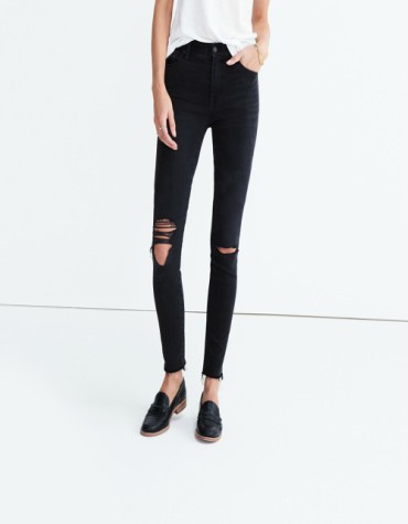 High-rise black skinny jeans with ripped knees