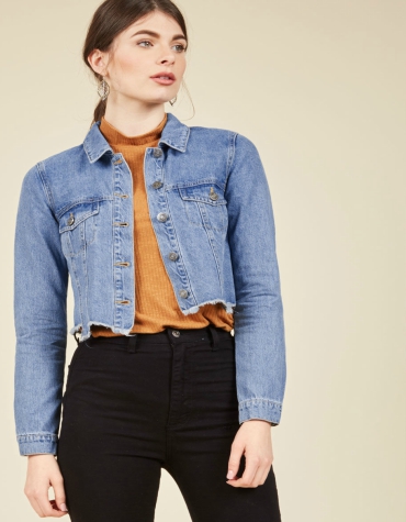 Cropped denim jacket with jagged edge detail in blue