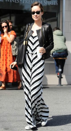 Olivia Wilde in stripe maxi dress with leather jacket and converse