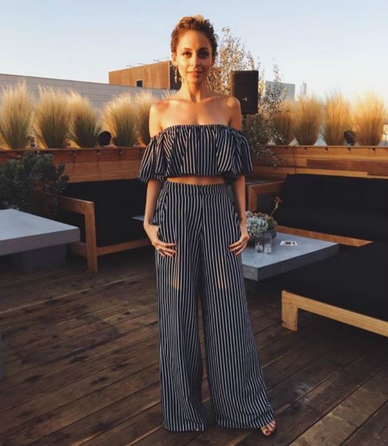 Nicole Richie wearing striped crop top w/ matching trousers