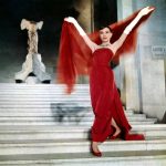 Audrey Hepburn wearing long red dress in funny face scene