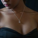 woman wearing black ball gown and necklace