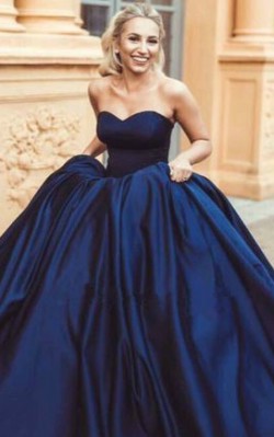 What to wear to a black tie wedding - full length strapless dark blue gown with puffy skirt