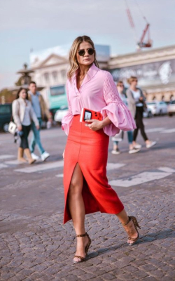 Woman in red pencil skirt with front slit and a pink shirt - 50 best pencil skirts