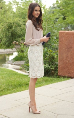 Model wearing white lace pencil skirt and pink blouse