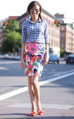 Model in floral pencil skirt and gingham shirt