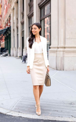 Woman in cream pencil skirt and white blazer