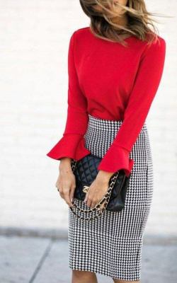 Model in red sweater and checked pencil skirt