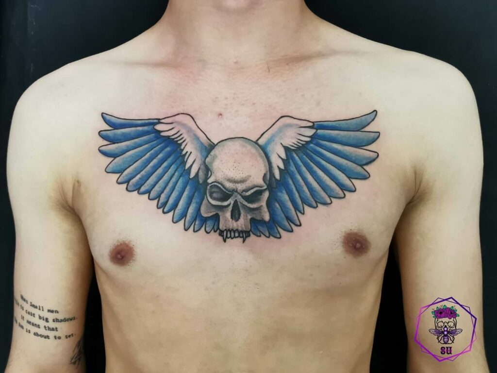 Skull With Wings Tattoo On Upper Back By Anthony Noble