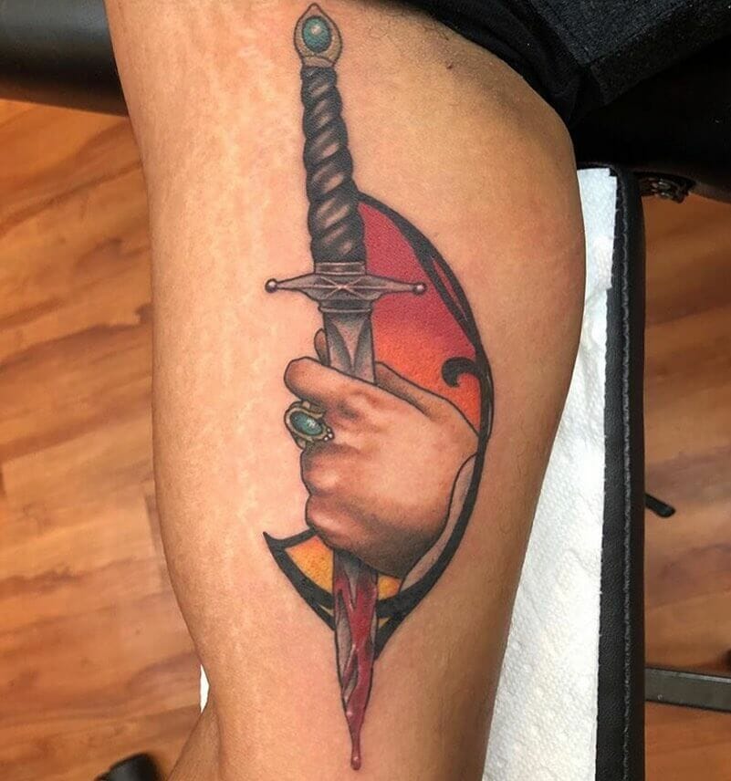 Black Hilted Dagger Laden With Blood Tattoo