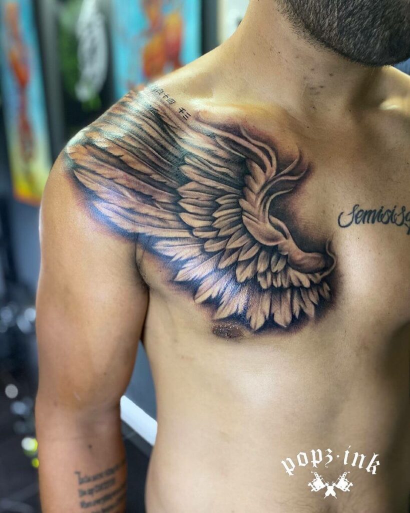 tribal wings chest tattoo