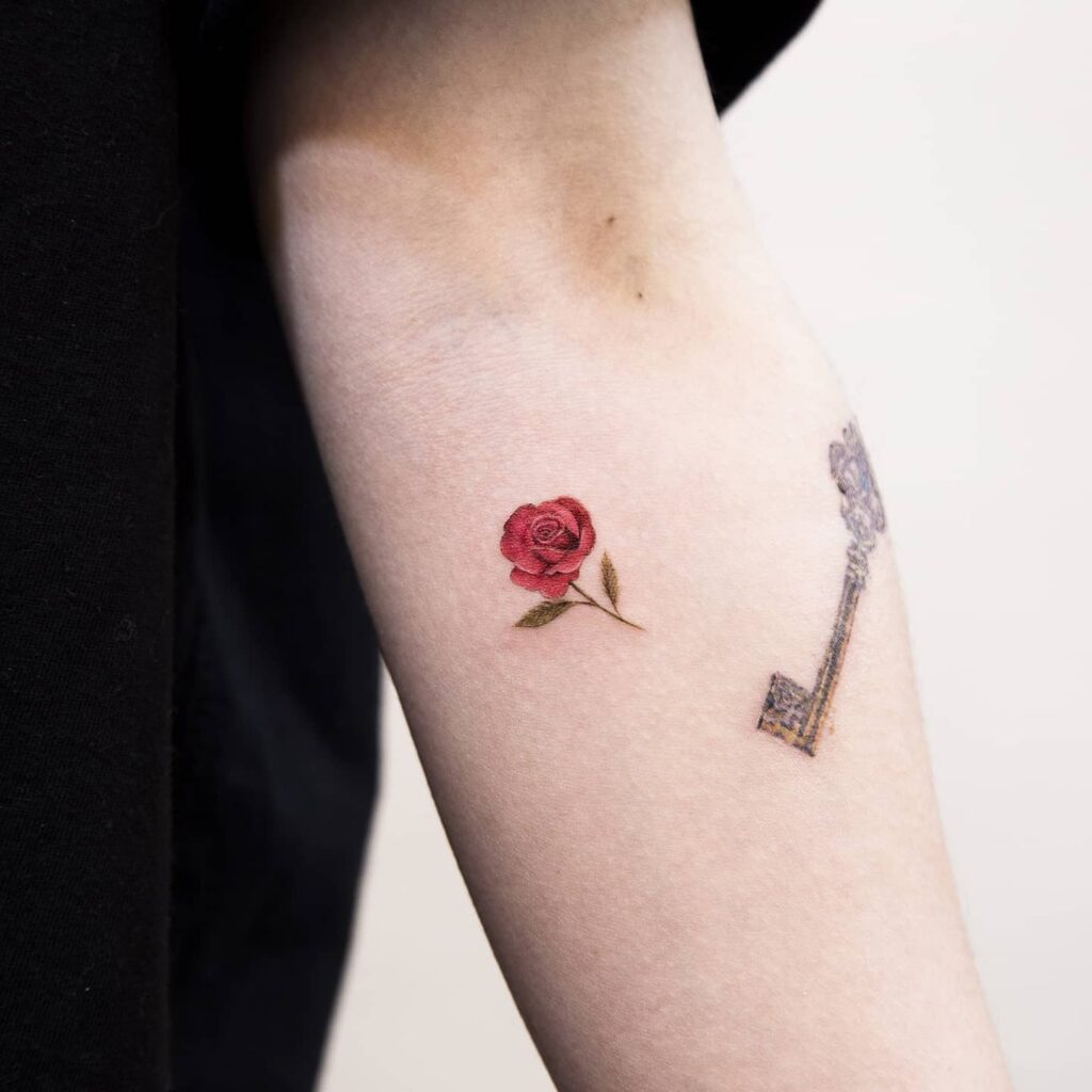 Left Arm Tiny Red Rose Bella Hadid Variation Tattoo Design