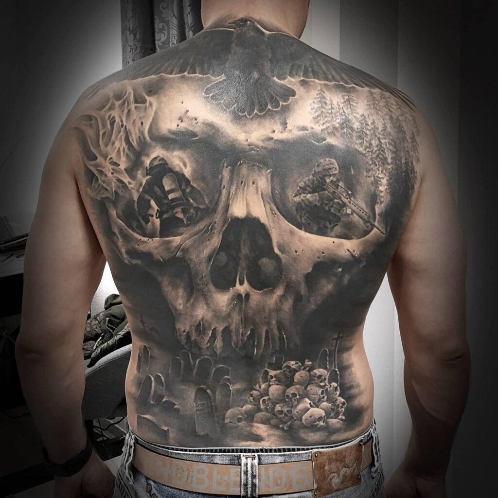 Black And Gray Skull Back Tattoo