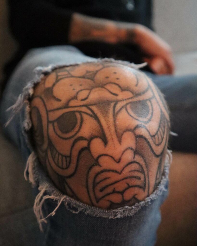 Upside Down Japanese Lion Tattoo on Knee