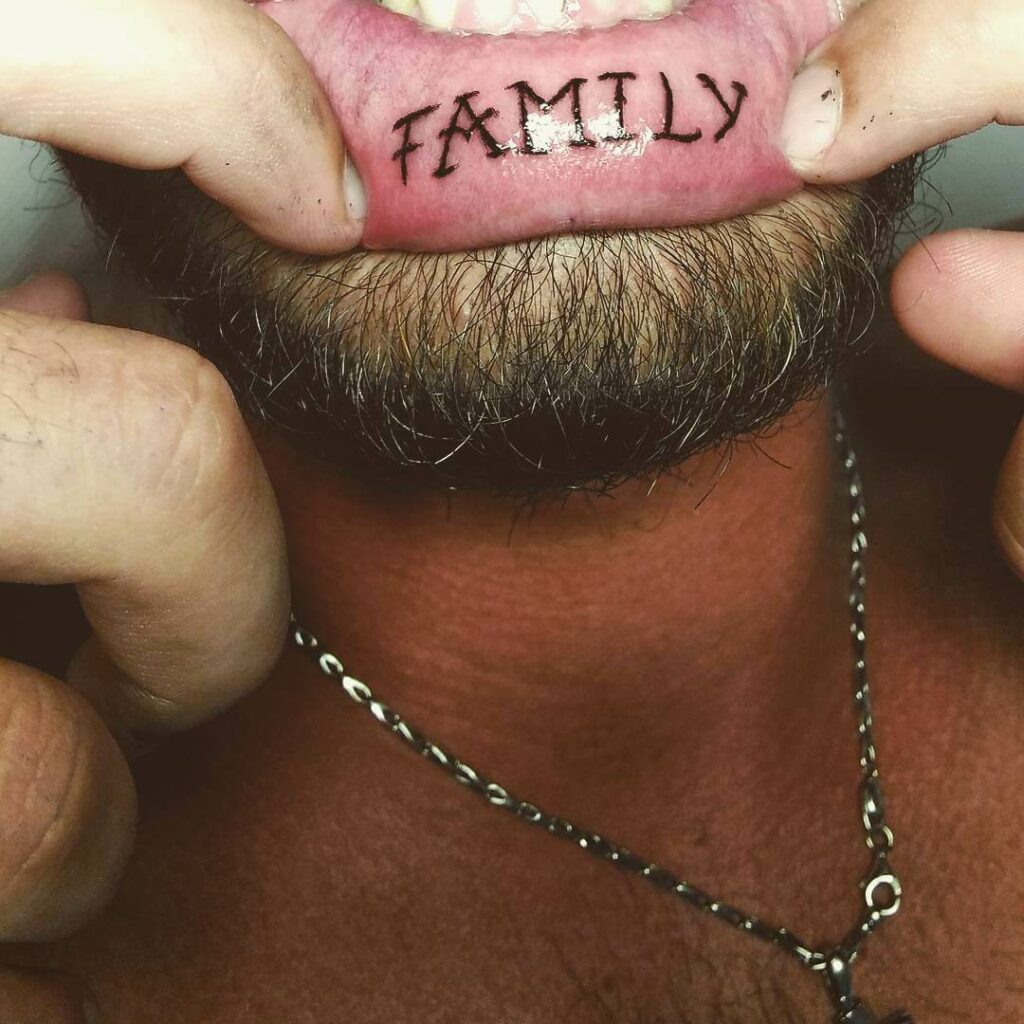 Striking Inner Lip Tattoo For Men