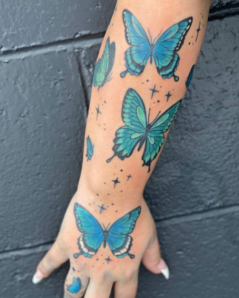 Blue Butterfly Tattoo On Arm