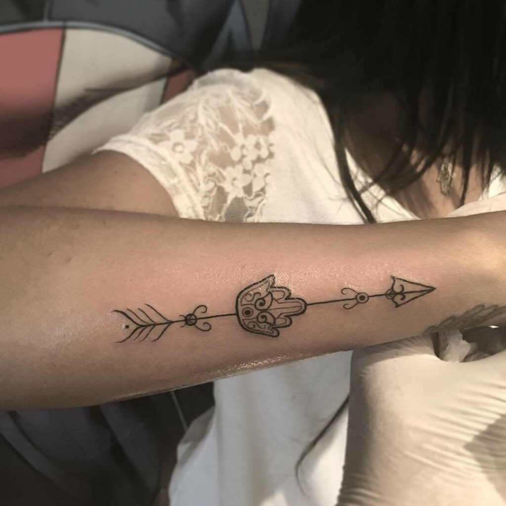 Small Hamsa Hand Tattoo With An Arrow
