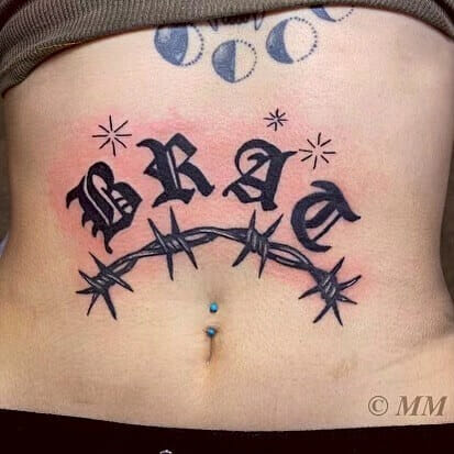 Brat Lettering and Barbed Wire Tattoo on Stomach