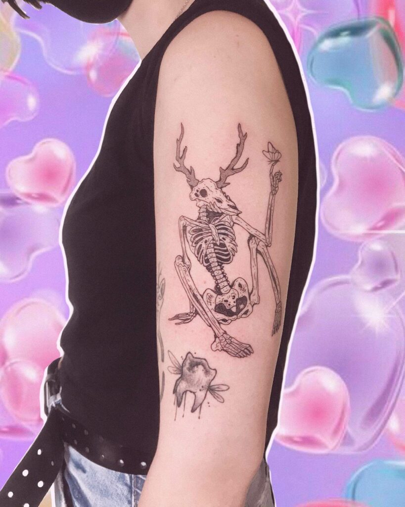 Butterfly X Wendigo Tattoo On Upper Arm