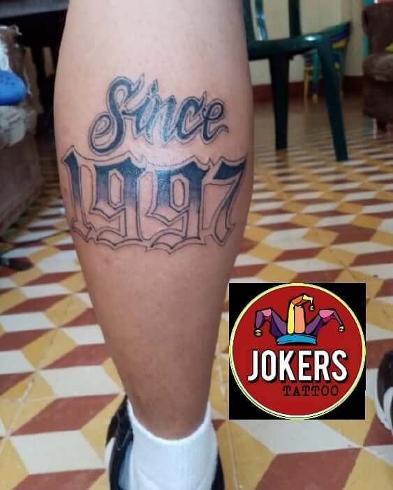 1997 Est Tattoos On Calf