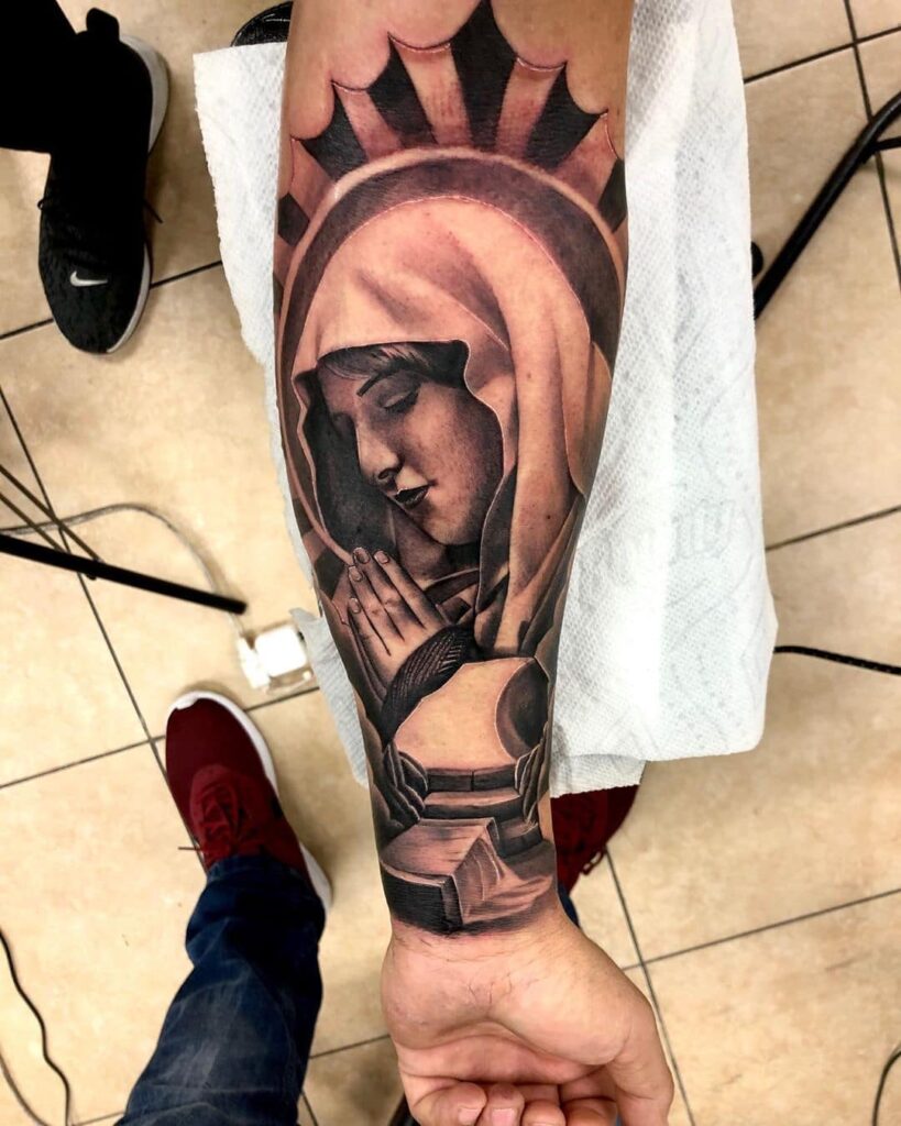 religious sleeve tattoos