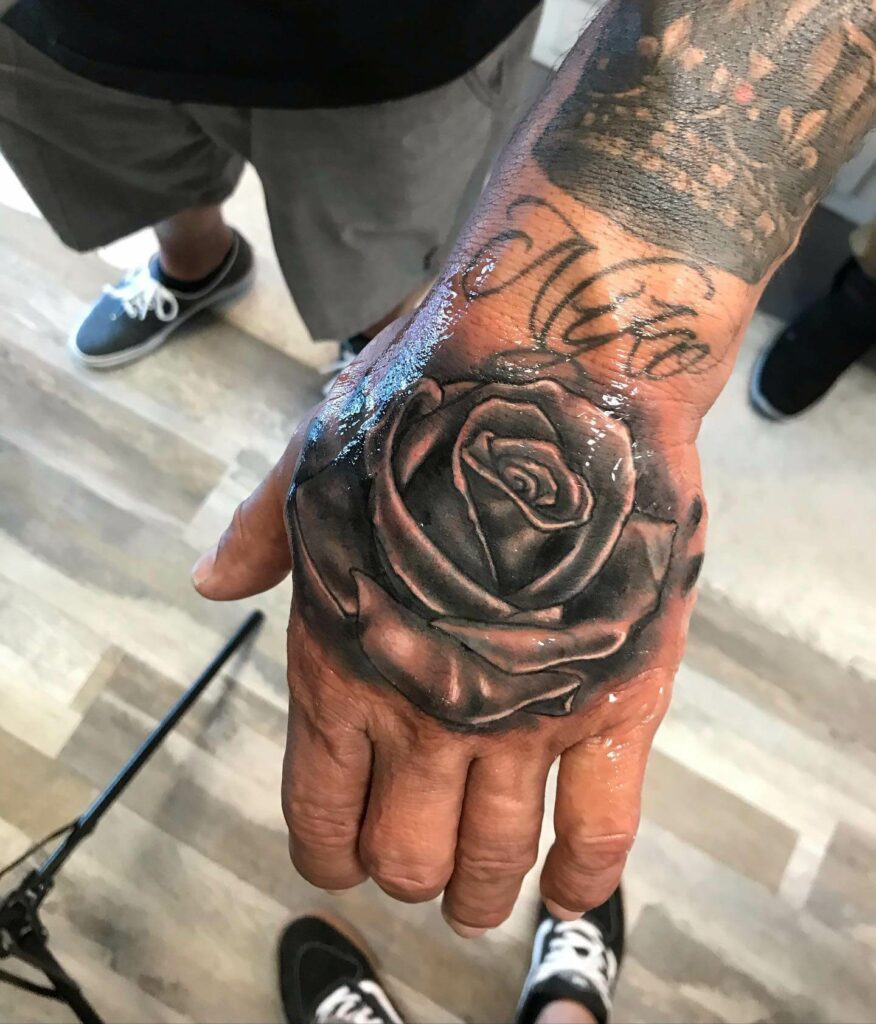 Hand piece tattoo black and grey realism  Hand tattoos Black and grey  tattoos Pieces tattoo