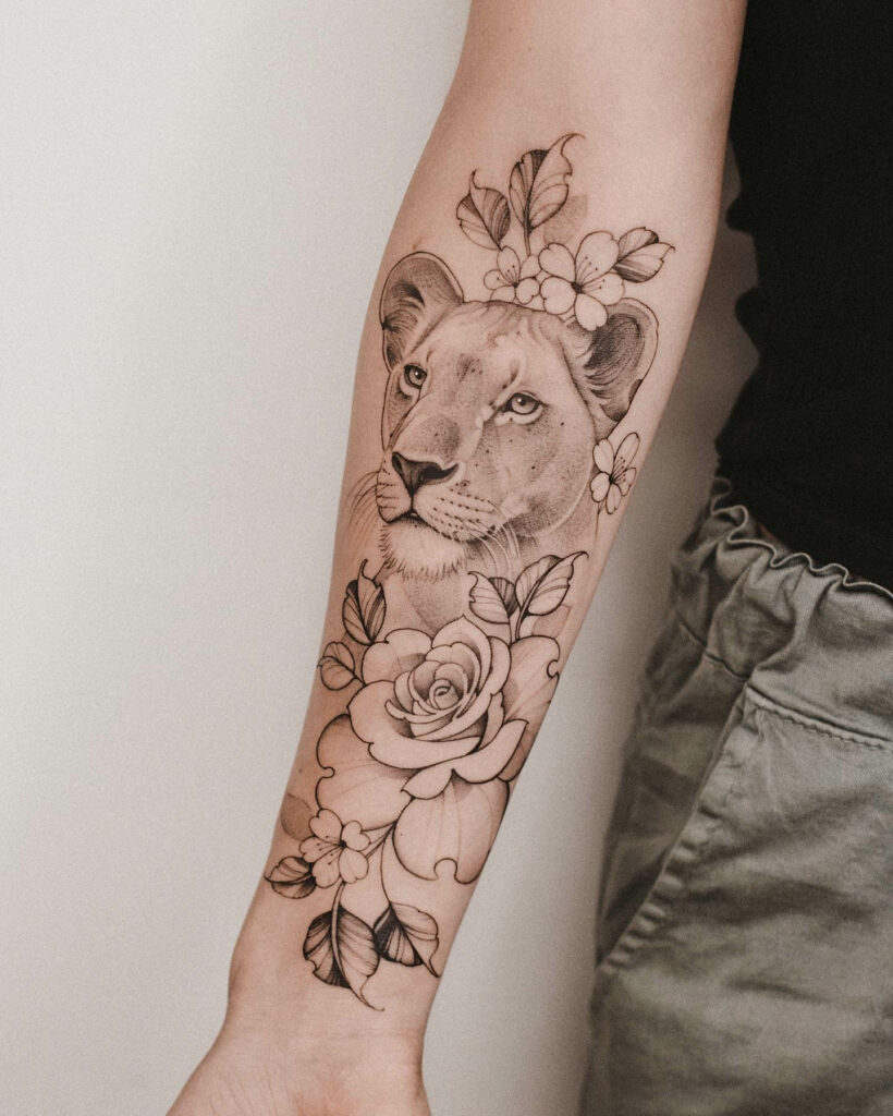 Lioness Tattoo With Flowers