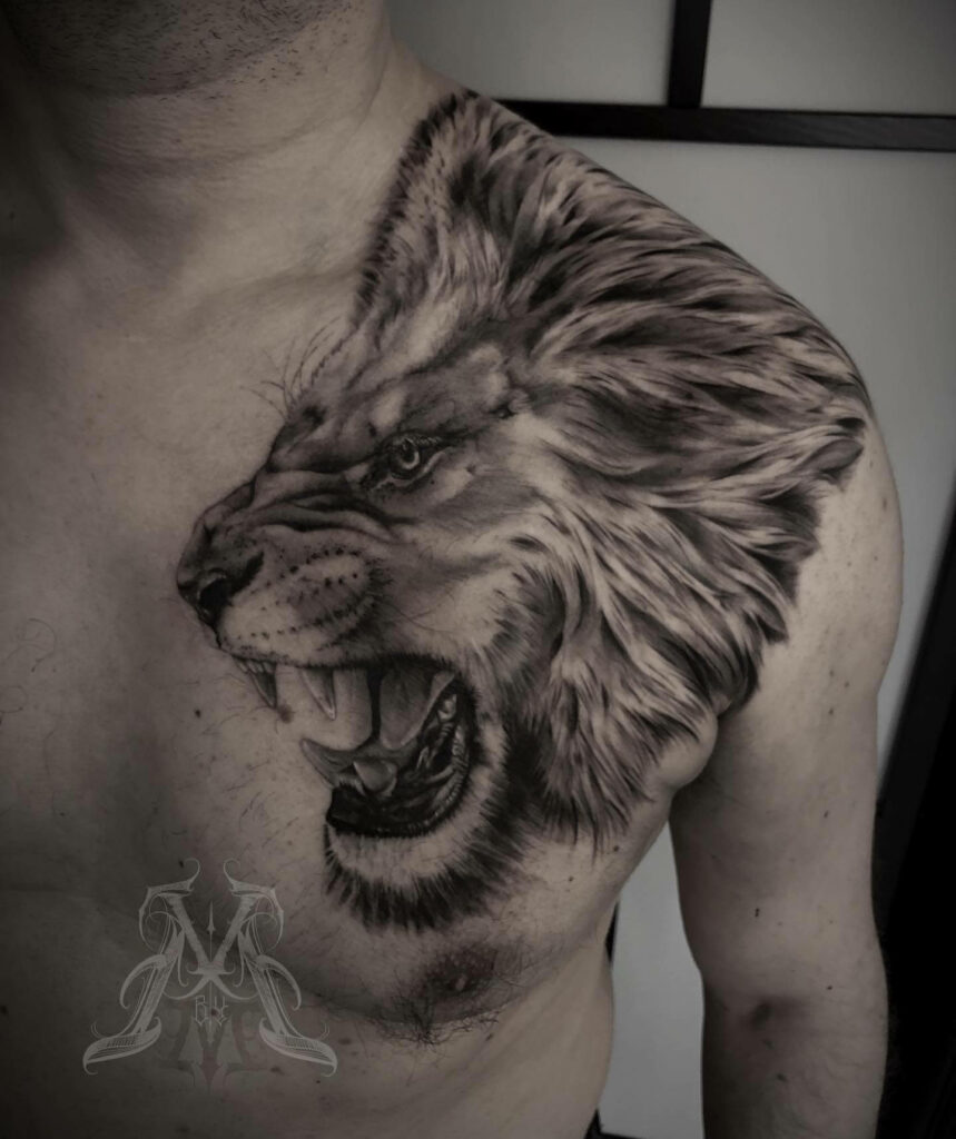 tribal lion chest tattoos