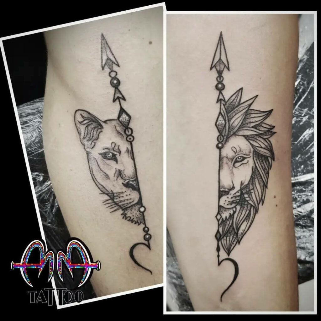 Lion and lioness tattoo on the inner arm.