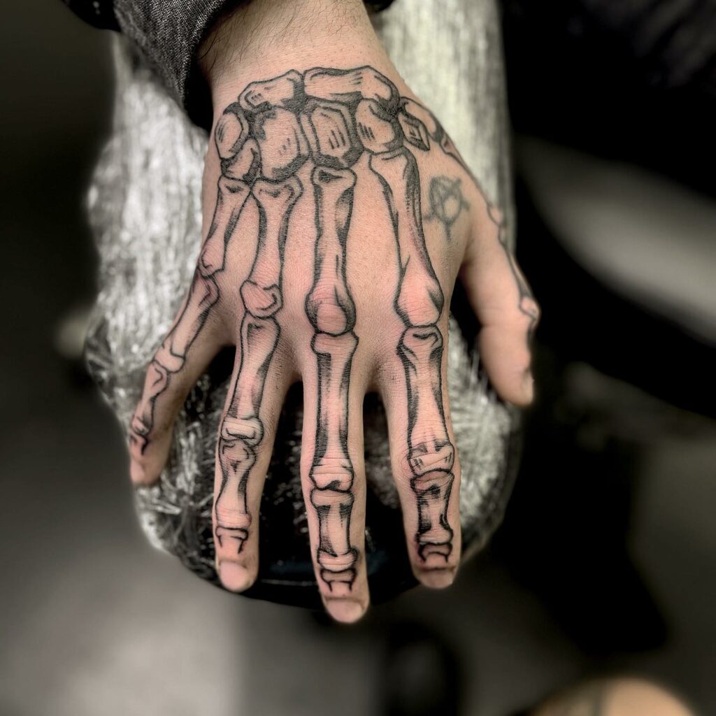 Simple skeleton rock hand tattoo ideas