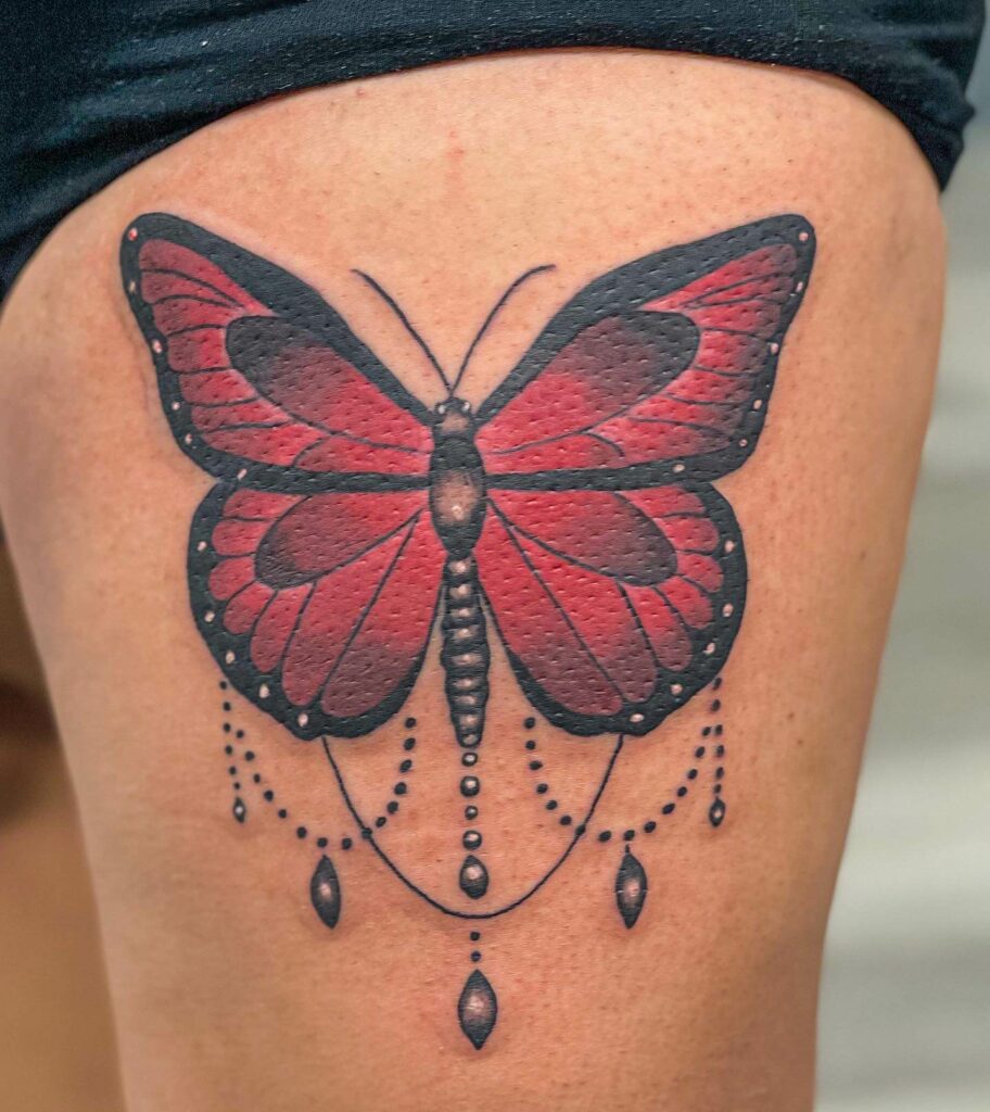 Red Butterfly Tattoo On The Hip