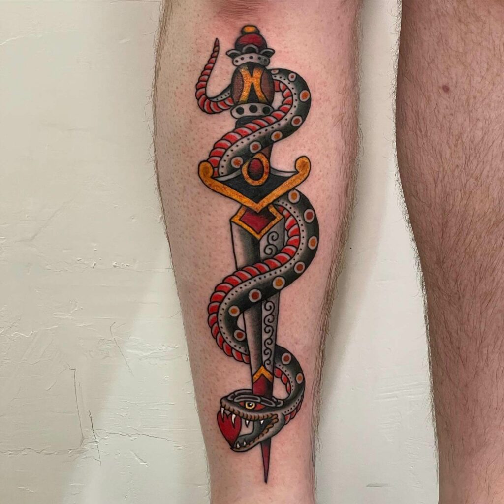 Snake And Dagger Arm Tattoo
