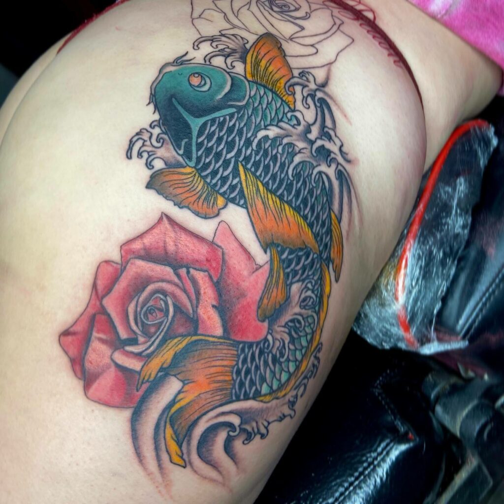 Rose And Koi Fish Hip Tattoo