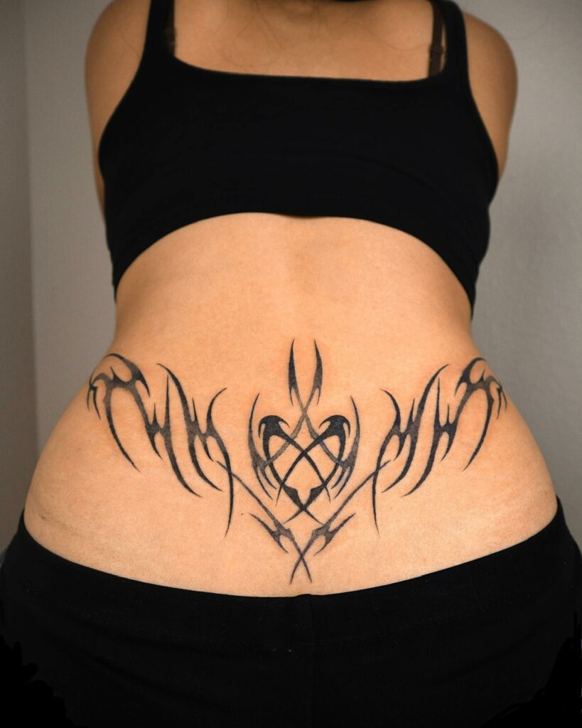 Sleek Abstract Heart Tattoo On The Hip