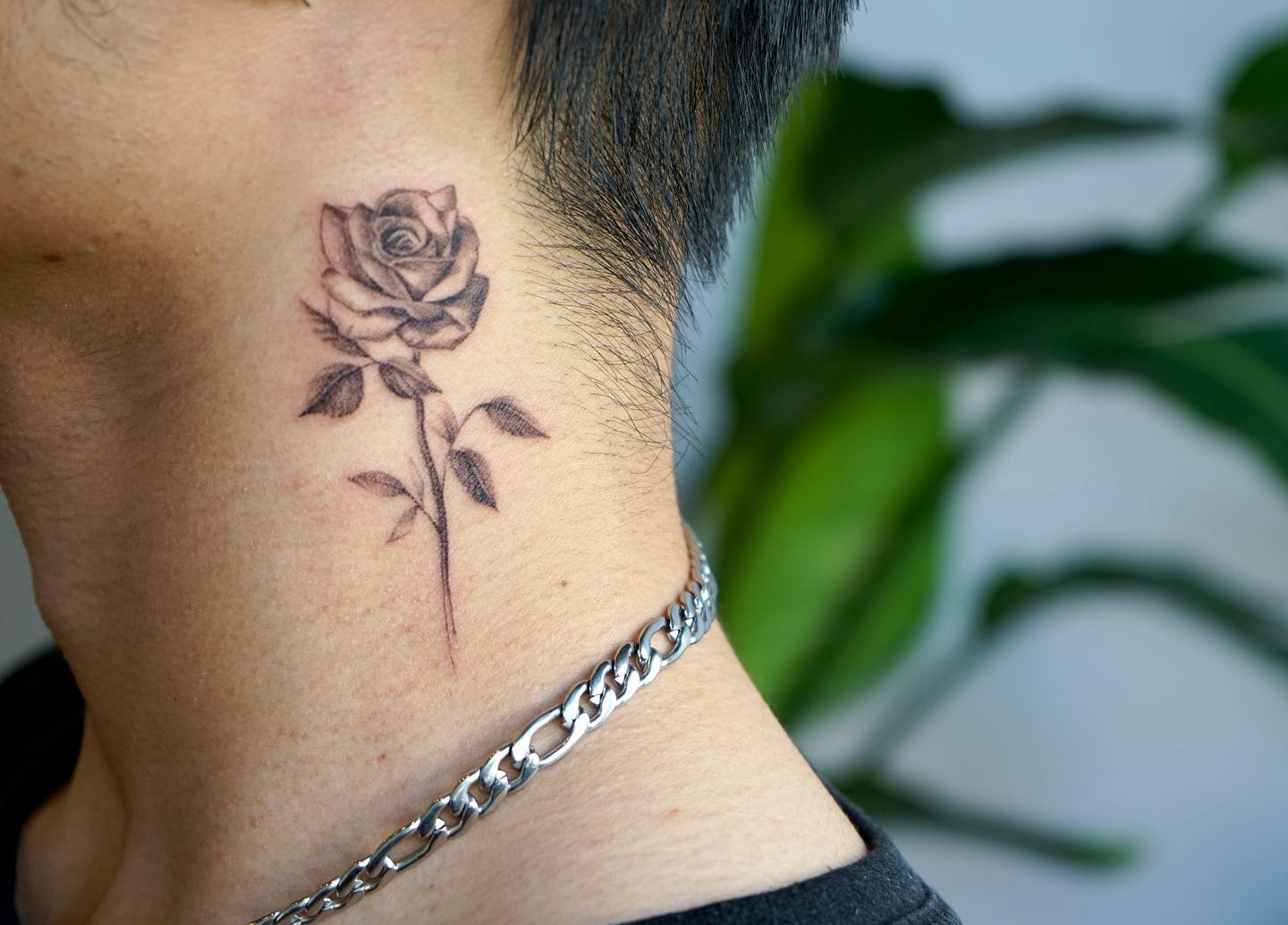 6. "Kiss Land" tattoo with a rose and thorns - wide 4