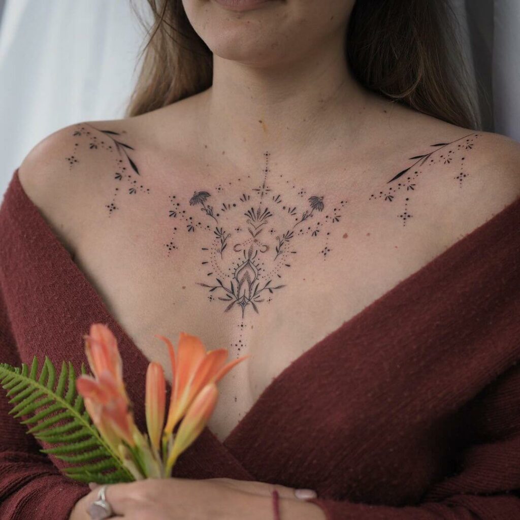 Delicate Ornamental Chest Tattoos for Women in Black Ink