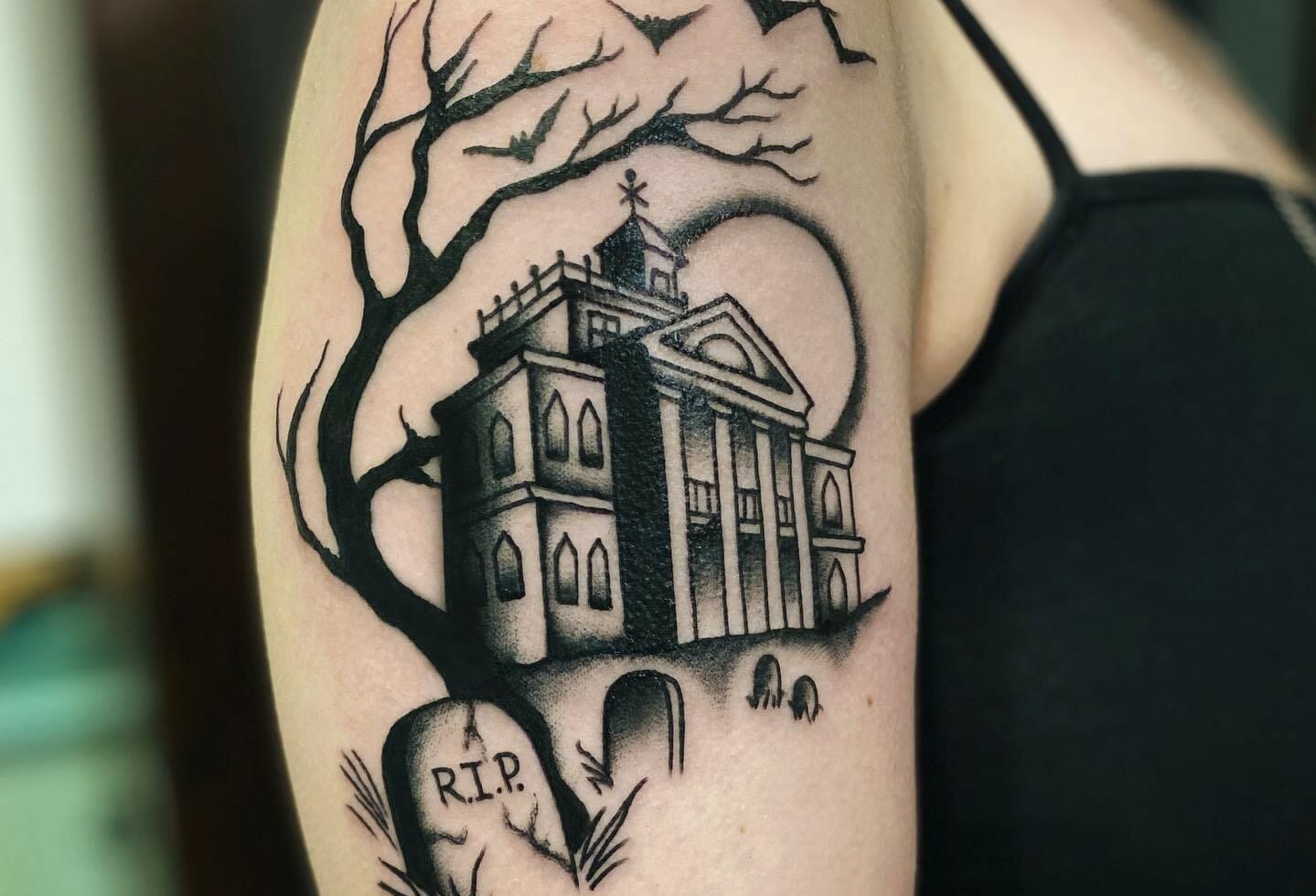 Minimalistic style house and dog paws tattooed on the