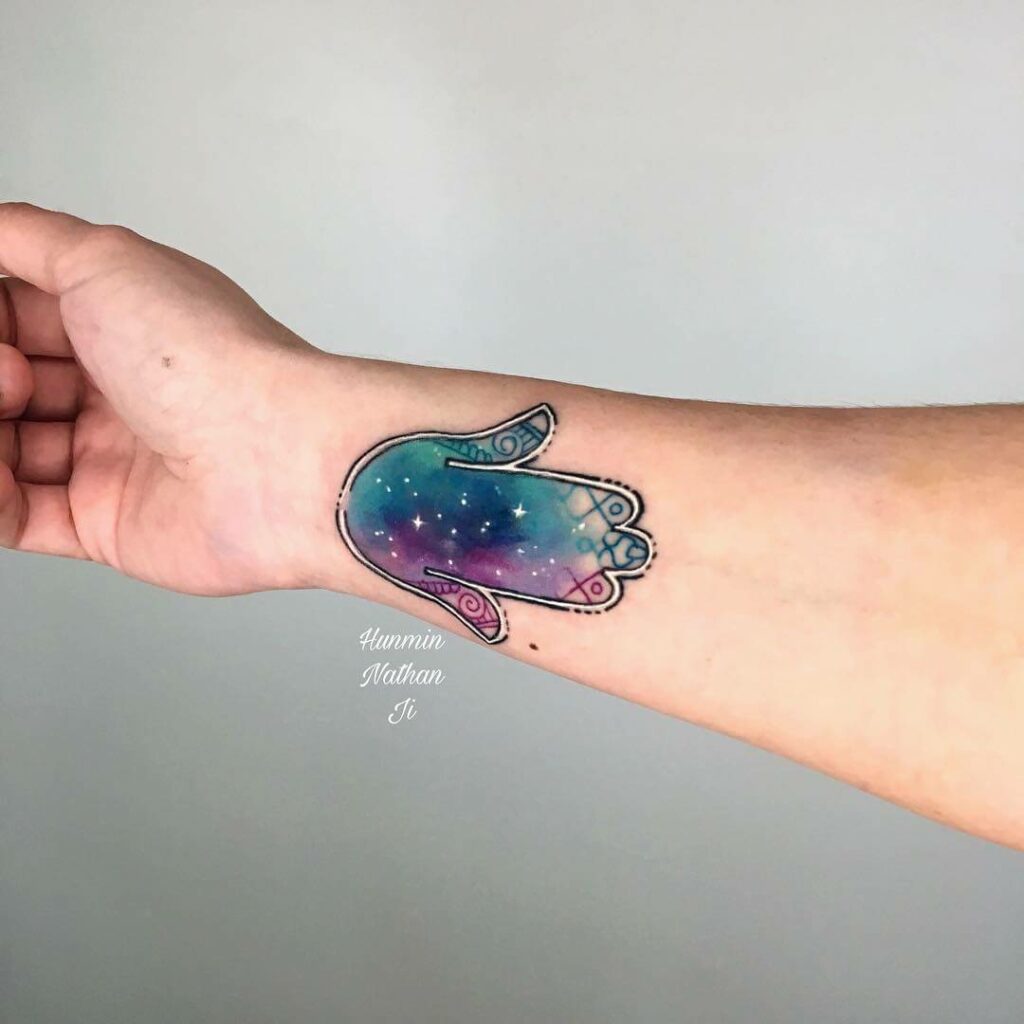 Galaxy Inside Of Hamsa Tattoo