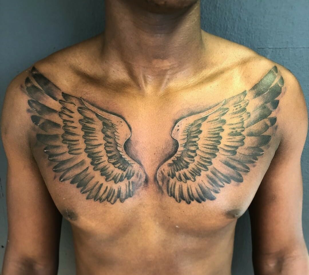 Share 66+ angel with wings chest tattoo latest