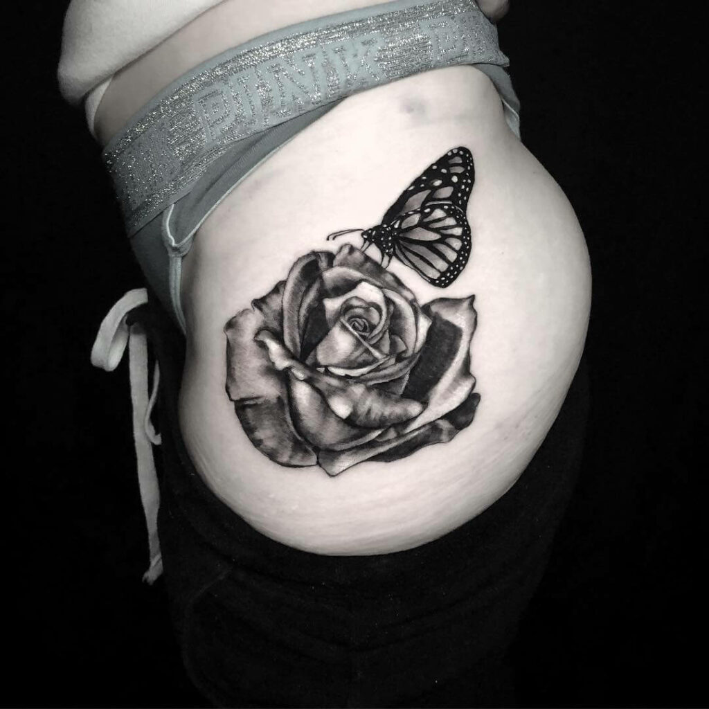 Black Outline Blue Butterfly Tattoo On Hip