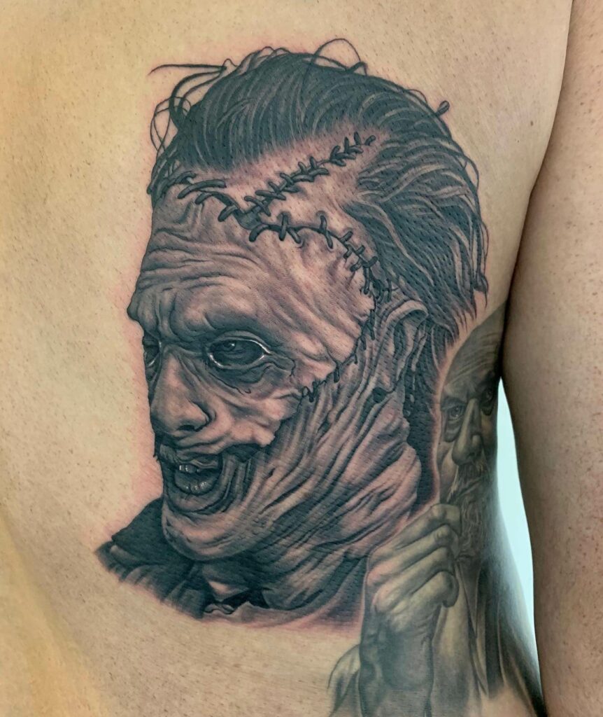 Leatherface Face Portrait Tattoo In Black And Grey