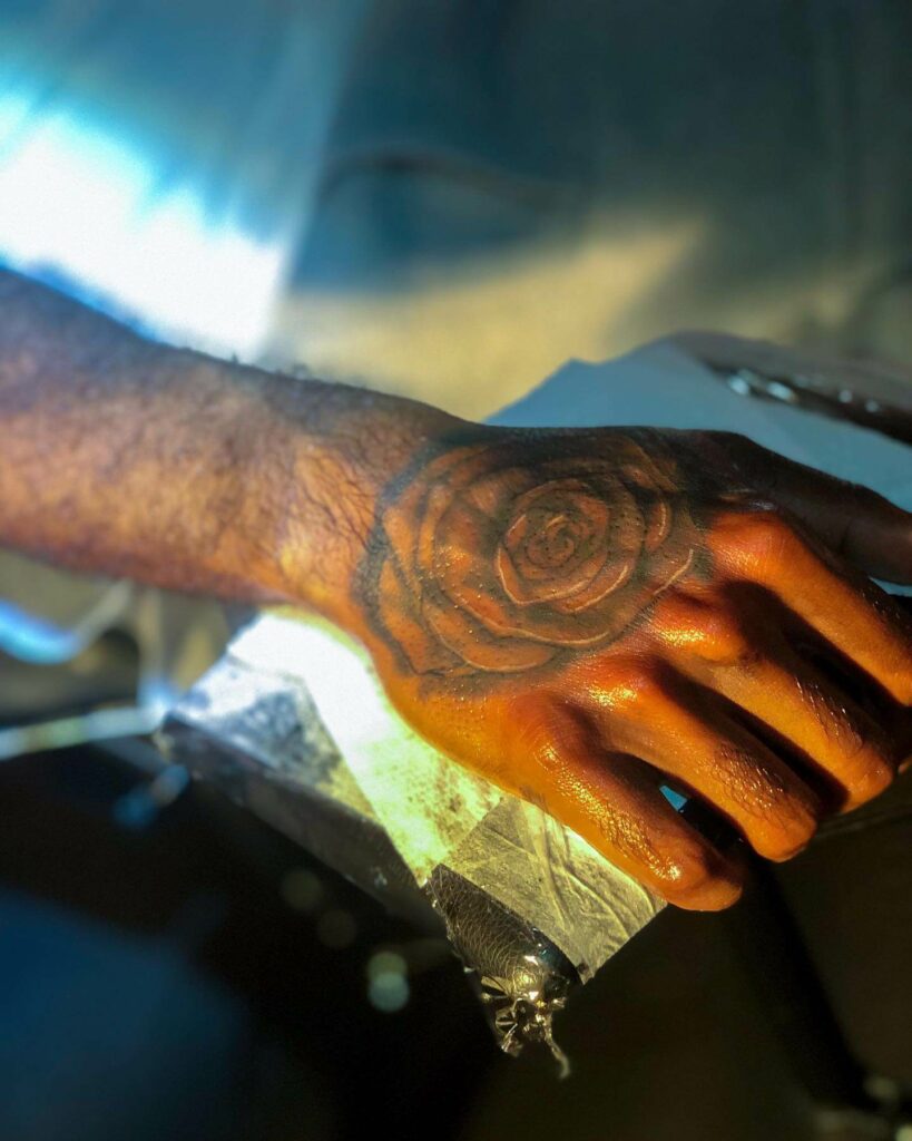  Traditional Big Black Rose Hand Tattoo