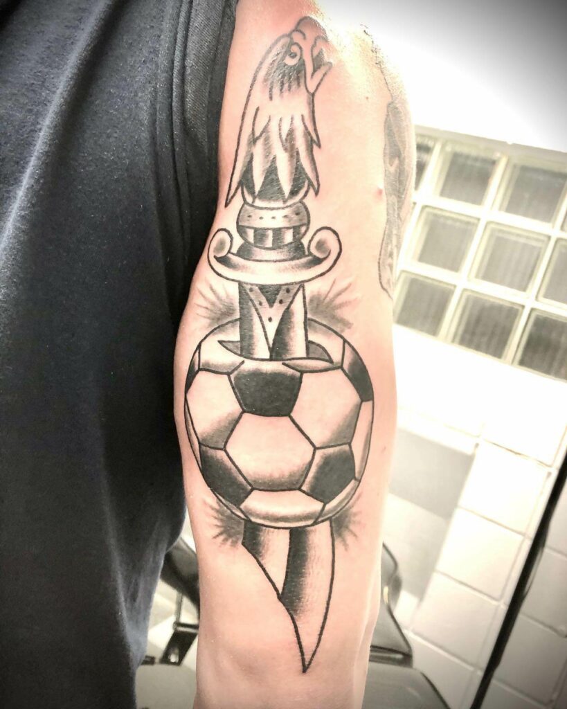 Bold Dagger And Soccer Tattoo