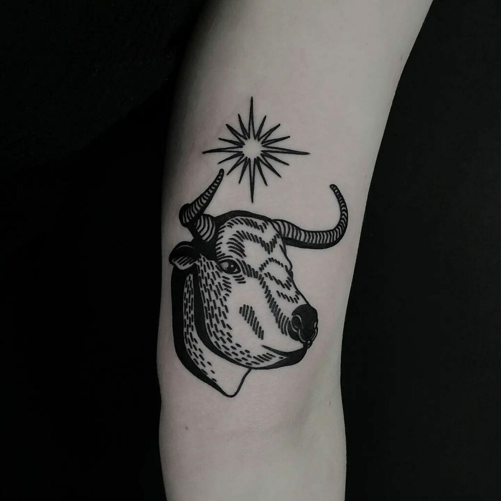 A Blackwork Bull and Stars Tattoo
